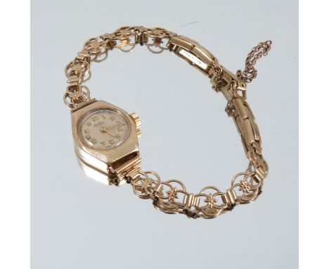 A bracelet of hollow curb links, together with a lady's wrist watch on a bracelet, and two chains, 36g gross, with a small co