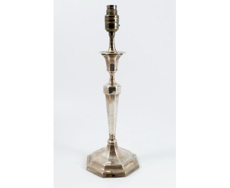 A silver table lamp, the sconce, column and stepped base of octagonal form, bearing a crest and military presentation inscrip