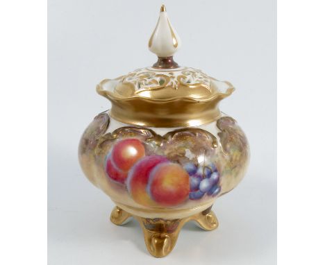 A Royal Worcester covered vase, having a pierced cover, the base decorated all a round with fruit to a mossy background by Dr