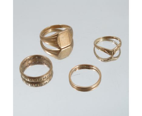 A 9 carat gold signet ring, together with a 9 carat gold wedding ring, a 9 carat gold eternity ring and a 9 carat gold wishbo