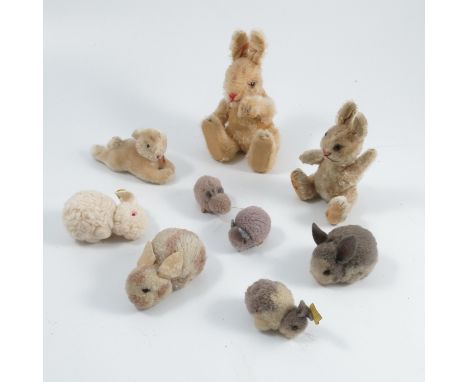A collection of plush and other rabbits, some with Steiff labels