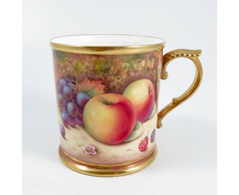 A Royal Worcester mug, decorated all around with fruit to a mossy background by P Platt, with gilt edge and handle, height 5i