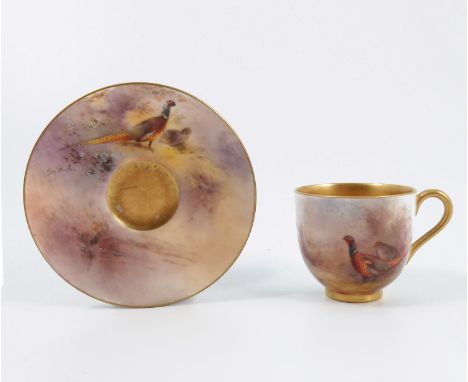 A Royal Worcester miniature cabinet cup and saucer, decorated with pheasants in landscape to the exterior of the cup and the 