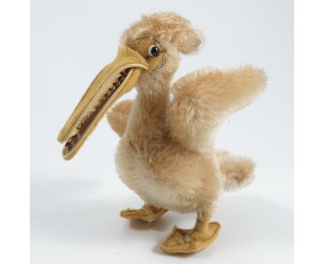 A Steiff pelican, with button, together with a plush chicken and another plush bird with wire legs and plastic beak