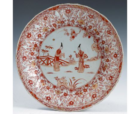 A late 17th/early 18th century Chinese rouge de fer saucer dish, decorated with figures, diameter 10.75ins, together with two