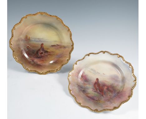 Two Royal Worcester cabinet plates, decorated with Grouse and Partridge in landscape, both by Jas Stinton, with gilt shaped e