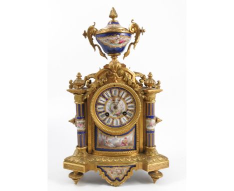 A 19th century gilt metal and porcelain mantel clock, the striking movement stamped Japy Freres, the dial decorated with a bi