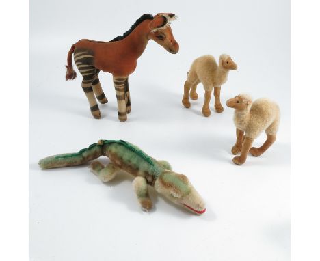 A Steiff&nbsp;Okapi, no labels or buttons, together with a Steiff crocodile, with label, and two camels, no labels