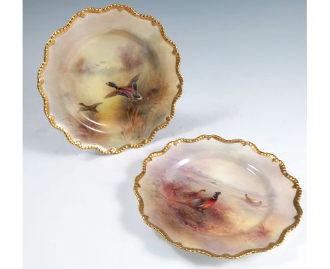 Two Royal Worcester cabinet plates, decorated with ducks in flight over reeds and water and pheasants in landscape, both by J