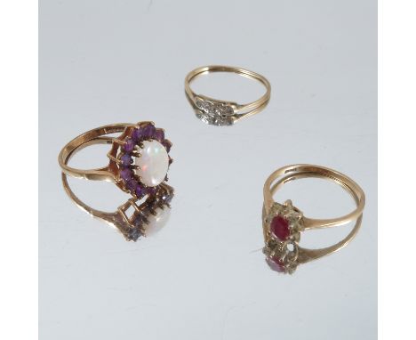 An opal and amethyst 9 carat gold cluster ring, together with a 9 carat gold cluster ring and a three stone diamond ring, 6.3