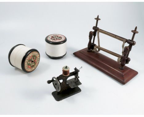 A collection of sewing related items, to include a mahogany tapestry frame, an H. Milward &amp; Sons Needle Fish Hook and Sew
