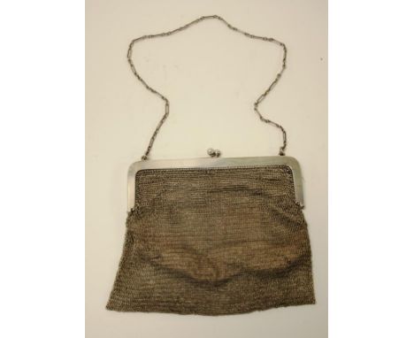 Ladies vintage silver mesh purse silk lined interior with embroidered trim. On silver carrying chain. W186grams approx.