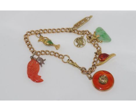 Vintage 15ct rose gold charm bracelet with yellow gold parrot clasp and various charms including enamel snail, coral fish and