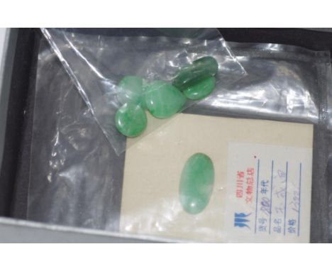 Six vintage various unset jade pieces one with original purchase information