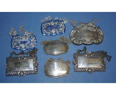 Seven assorted silver plate decanter labels