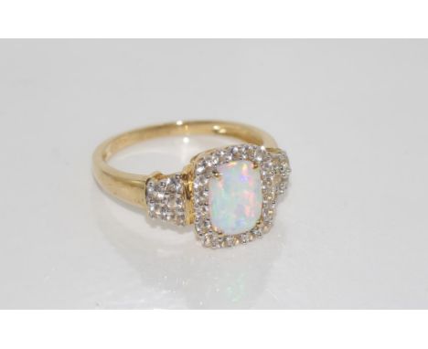 10ct yellow gold, opal and cz ring weight: approx 3 grams, size: O/7