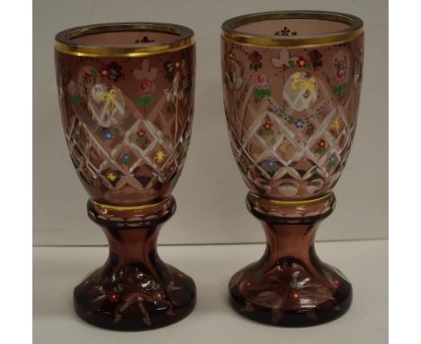 Pair Bohemian amethyst glass vases handpainted enamel floral decoration. Height 17cms approx. (each).