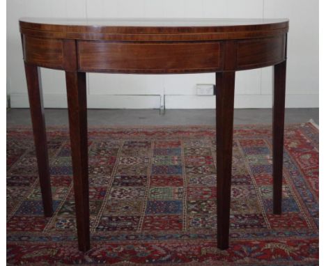 George III mahogany demi-lune tea table with double gate strung in boxwood on square tapered legs.  94 wide x 74 high