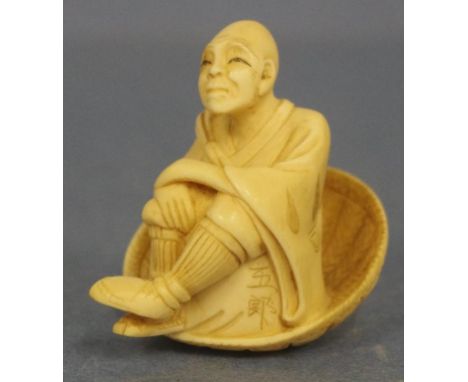 Antique Japanese man in basket ivory netsuke C1920. this item may not be exported without CITES documentation.. H3cms approx.