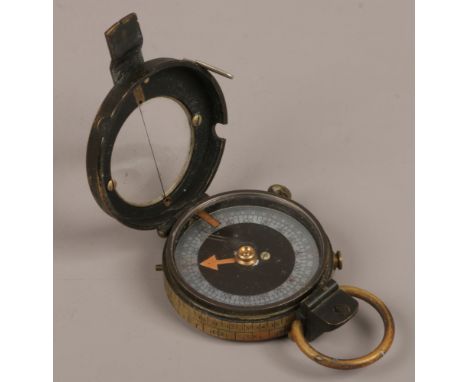 A World War I Verniers patent brass compass with mother of pearl dial.