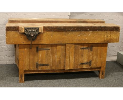 A large timber workshop workbench with cupboard base and mounted with a record No. 52 vice 152.5cm x 78cm x 80cm.Condition re