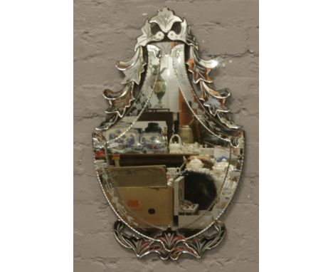 An ornate Venetian style mirror.