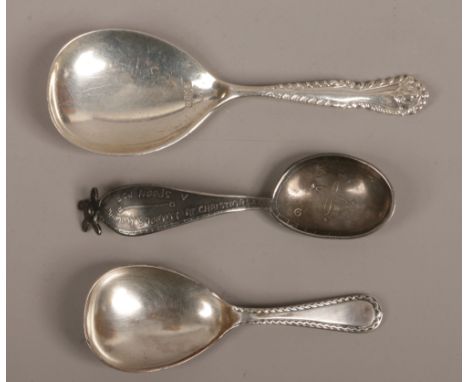 Two silver caddy spoons and a medicine spoon.