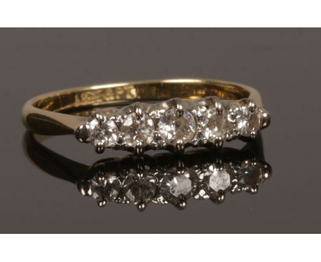 An 18ct gold and platinum five stone diamond ring, size M, 2.16 grams.