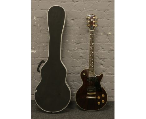 A vintage Kasuga custom Gibson Les Paul style six string electric guitar with rosewood effect head stock and body and mother 