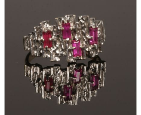 A 9ct white and yellow gold modernist dress ring set with spinel and ruby, assayed London 1971, size N.