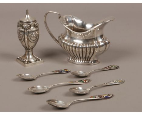 A Victorian silver Adams revival style caster, along with five silver and enamel collectors spoons and a silver plate cream j