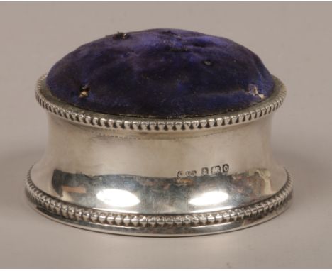 An Edwardian silver pin cushion assayed Birmingham 1902.Condition report intended as a guide only.Makers mark rubbed.
