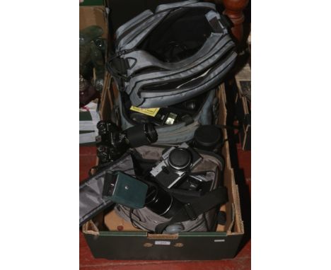 A box of vintage cameras and accessories including Praktica BC1, Minolta X-300 etc.