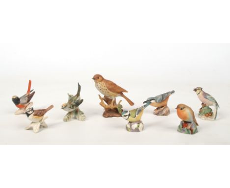Four Royal Worcester models of birds; Blue Jay, Robin, Blue Tit and Nuthatch, along with three Goebel birds etc.