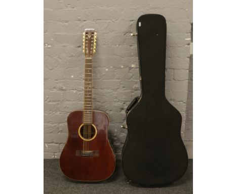 A vintage Daion twelve string acoustic guitar in hard carry case.Condition report intended as a guide only.Lock missing on ca