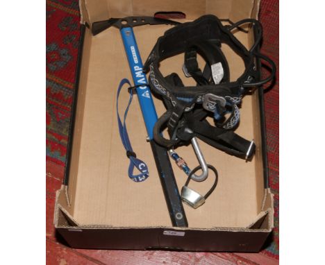 A wild country adjustable rock climbing harness with black diamond belay device and a karabiner, along with a camp jolly walk