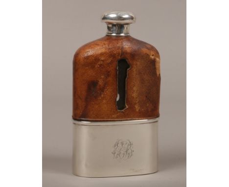 A Victorian leather bound glass hip flask with silver top and cup, assayed London 1886 by Morita Wolfsky.Condition report int