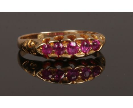 A Victorian gold five stone ruby ring with a boat shaped setting, size N.