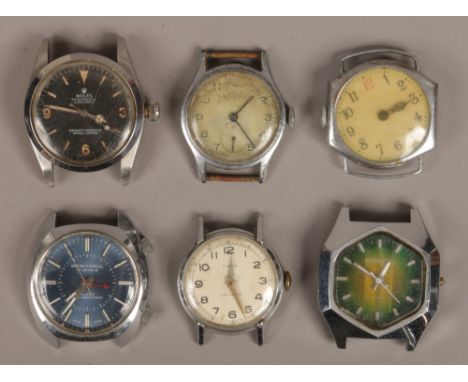 Six gentleman's stainless steel manual watch heads, spares or repair.