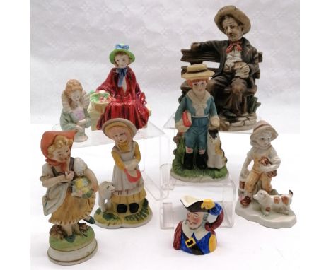 Collection of ceramic figures to include a man on a bench, boy with a dog, etc. To include Sylvac Staffordshire. Tallest meas