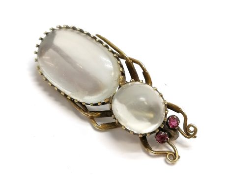 Antique yellow metal bug brooch set with moonstone and ruby set eyes - 43mm long and does have scrape on metal near end of br