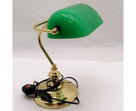 Brass bankers lamp with a green glass shade. Measures 35cm high. 