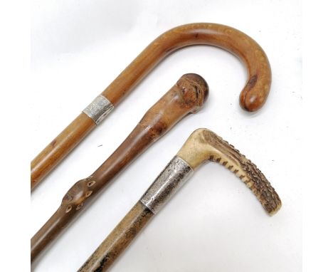 Antler and unmarked silver handled walking stick 81cm long T/W a root wood stick and a silver collared walking stick 