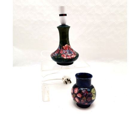 Moorcroft lamp depicting flowers in good used condition t/w smaller a/f Moorcroft pot. Tallest measuring 26cm high. 