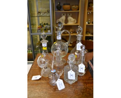 A Mary Gregory-style spirit decanter, together with various other decanters, bottles and jars, including one with enamel cap