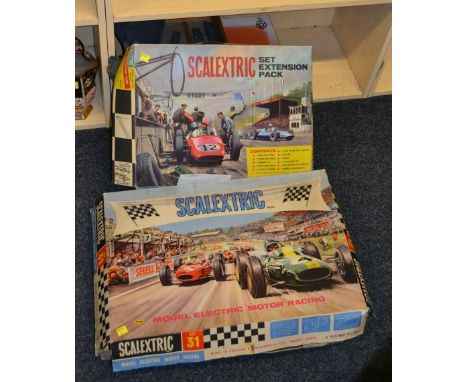 A Scalextric No 31 set, together with a set extension pack, Subbuteo table hockey and a Tri-Ang fort