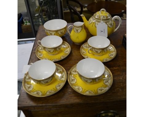 A Royal Worcester tea service, comprising pot, cream, sugar, four cups and saucers, each floral transfer decorated on a lemon