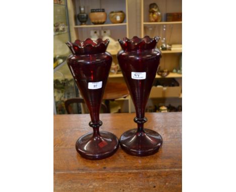 A pair of Victorian tall ruby glass vases, of baluster urn form with waved rims, 33 cm (13 1/2 in) high