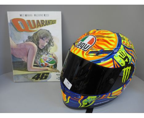 A special edition AGV Valentino Rossi crash helmet with artwork, with a Quarantasei Valentino Rossi graphic novel book, displ