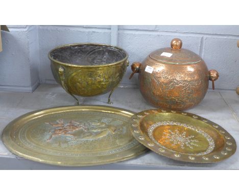 An Indian copper pot with liner, a brass pot, a brass plaque with mythical hunting scene and a brass dish **PLEASE NOTE THIS 